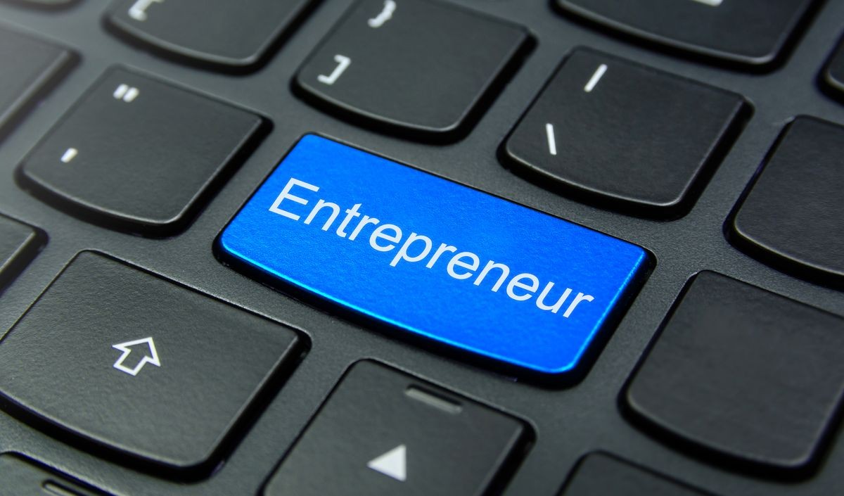 Business Concept: Close-up the Entrepreneur button on the keyboard and have Azure, Cyan, Blue, Sky color button isolate black keyboard